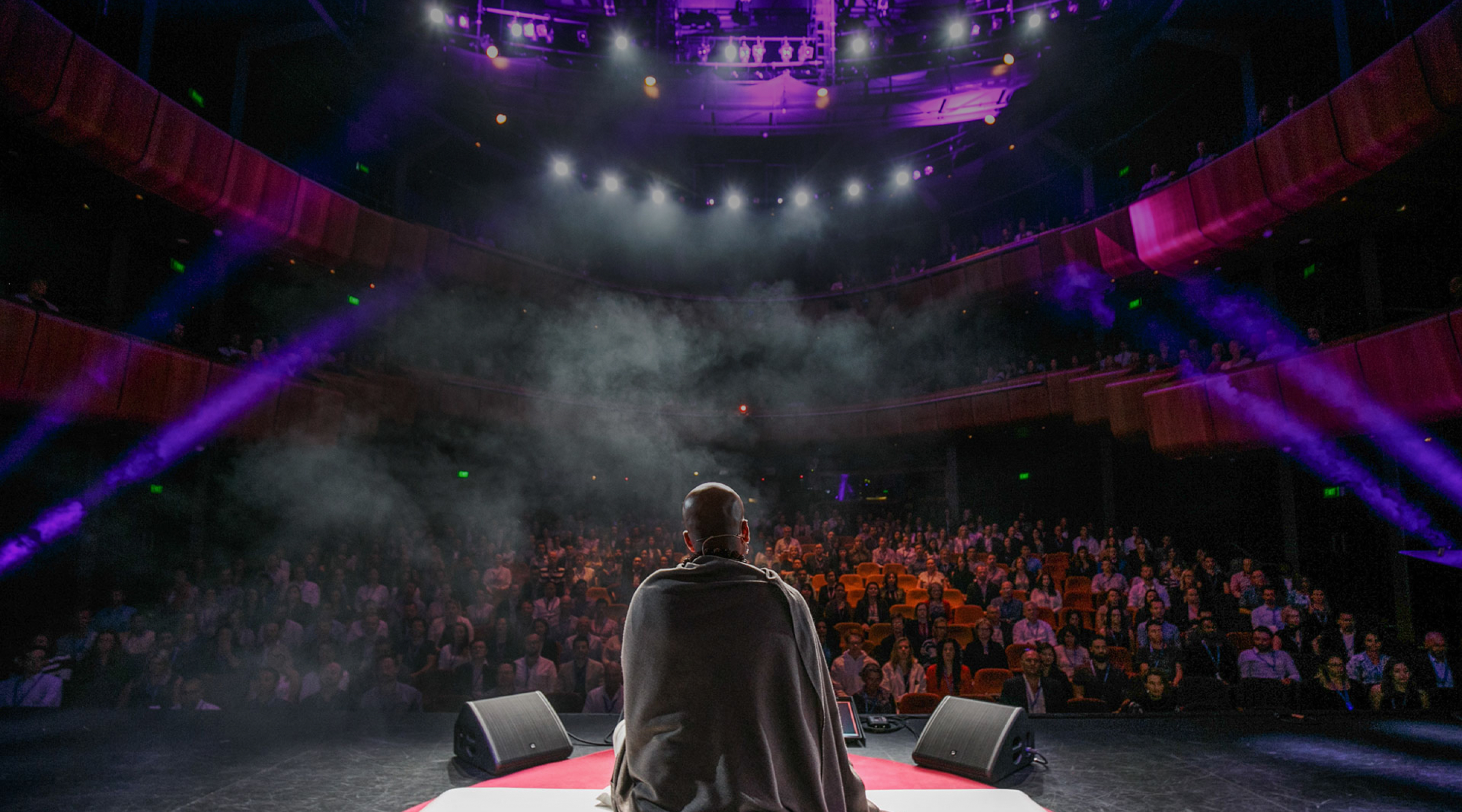 Picture of Dandapani talking to a group of people