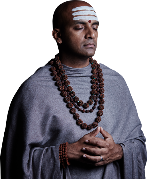 Dandapani standing peacefully with hands crossed and eyes closed